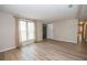 Bright living room featuring new floors, neutral paint, and large window at 125 Valley View Ct, Tyrone, GA 30290