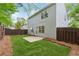Fenced backyard with green lawn and patio, perfect for outdoor entertaining and recreation at 1433 Chardin Dr, Marietta, GA 30062