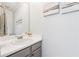 Clean bathroom with a large mirror, white countertops, and neutral-colored cabinets at 1433 Chardin Dr, Marietta, GA 30062