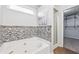 Bathroom featuring a soaking tub, separate shower, and modern mosaic tile accents at 1433 Chardin Dr, Marietta, GA 30062