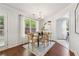 Cozy dining room with natural light, hardwood floors, and stylish chandelier at 1433 Chardin Dr, Marietta, GA 30062