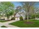 Well-maintained home with a manicured lawn and mature trees in a residential neighborhood at 1433 Chardin Dr, Marietta, GA 30062