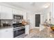 Well-equipped kitchen with granite countertops, stainless steel appliances, and a mosaic backsplash at 1433 Chardin Dr, Marietta, GA 30062