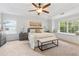 Serene main bedroom with large windows, tray ceiling, and a cozy window seat at 1433 Chardin Dr, Marietta, GA 30062