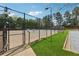 Community tennis court surrounded by lush greenery, promoting an active and healthy lifestyle at 1433 Chardin Dr, Marietta, GA 30062