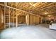 Spacious unfinished basement with concrete floor, exposed timber construction, and roughed-in utilities at 185 Vandiver Ct, Acworth, GA 30101