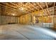 Unfinished basement with poured concrete floor and exposed timber construction at 185 Vandiver Ct, Acworth, GA 30101