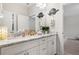 Well-lit bathroom boasts double sinks with granite counters and decorative accents at 185 Vandiver Ct, Acworth, GA 30101