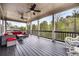Relaxing covered porch with outdoor seating and ceiling fans offers a comfortable space for outdoor enjoyment at 185 Vandiver Ct, Acworth, GA 30101