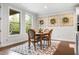 Cozy dining area with natural light from windows and wood table at 185 Vandiver Ct, Acworth, GA 30101