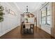 Elegant dining room with hardwood floors, chandelier lighting, and stylish decor at 185 Vandiver Ct, Acworth, GA 30101