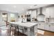 Beautiful open kitchen with stainless steel appliances, island with seating, and a breakfast nook at 185 Vandiver Ct, Acworth, GA 30101