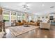 Spacious living room featuring hardwood floors, large windows, and stylish furnishings at 185 Vandiver Ct, Acworth, GA 30101