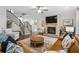 Warm and inviting living room with a stone fireplace and an elegant staircase at 185 Vandiver Ct, Acworth, GA 30101