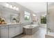 Beautiful bathroom with large soaking tub, dual vanities and a separate shower enclosure at 185 Vandiver Ct, Acworth, GA 30101