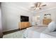 Bright main bedroom with a tray ceiling, ceiling fan, and en-suite bathroom at 185 Vandiver Ct, Acworth, GA 30101