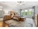 Serene main bedroom with tray ceiling, large windows, hardwood floors, and elegant furnishings at 185 Vandiver Ct, Acworth, GA 30101