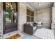 Inviting front porch seating area with comfortable chairs and a welcoming atmosphere at 185 Vandiver Ct, Acworth, GA 30101