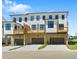 Modern townhome with attached garages and private balconies, showing contemporary design and inviting outdoor spaces at 2842 Evanshire Ave # 113, Duluth, GA 30096