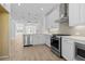 Bright kitchen with modern appliances, white cabinetry, and a view into the living area at 2842 Evanshire Ave # 113, Duluth, GA 30096