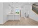 Bright, modern kitchen with pendant lighting, stainless appliances and adjacent staircase at 2842 Evanshire Ave # 113, Duluth, GA 30096