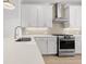 Updated kitchen featuring white cabinets, stainless steel appliances, and quartz countertops at 2842 Evanshire Ave # 113, Duluth, GA 30096