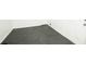 View of the basement's tile flooring near a white door and white walls at 4322 Glenwood Pkwy, Decatur, GA 30032