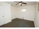 Simple bedroom design with hardwood floors, a ceiling fan, a window and white walls at 4322 Glenwood Pkwy, Decatur, GA 30032
