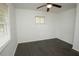 Bedroom featuring hardwood floors, a ceiling fan, a window and white walls at 4322 Glenwood Pkwy, Decatur, GA 30032