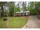 Lovely brick home with mailbox and ample parking space, nestled in a wooded area at 4322 Glenwood Pkwy, Decatur, GA 30032