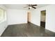Spacious living room with ceiling fan, windows and beautiful dark wood flooring at 4322 Glenwood Pkwy, Decatur, GA 30032