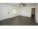 Spacious living room with a ceiling fan, lots of natural light, and neutral wall color at 4322 Glenwood Pkwy, Decatur, GA 30032