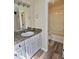 Bathroom features modern vanity, granite countertop, and separate tub/shower at 4460 Branchwood Ct, Loganville, GA 30052
