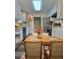 Cozy kitchen with white cabinets, stainless steel appliances, and a dining area at 4460 Branchwood Ct, Loganville, GA 30052
