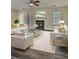 Bright and stylish living room featuring a fireplace, white sofas, and contemporary decor at 4460 Branchwood Ct, Loganville, GA 30052