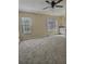 Large main bedroom boasts abundant natural light and neutral wall-to-wall carpeting at 4460 Branchwood Ct, Loganville, GA 30052