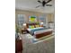 Spacious main bedroom with modern decor, large windows, and ensuite bathroom access at 4460 Branchwood Ct, Loganville, GA 30052