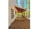Long, covered porch offering ample outdoor space and scenic views at 4460 Branchwood Ct, Loganville, GA 30052