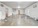 Unfinished basement with concrete floor, basketball hoops, and natural light at 4528 Venus Sw Ct, Powder Springs, GA 30127