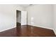Neutral bedroom boasts hardwood floors and a closet at 4528 Venus Sw Ct, Powder Springs, GA 30127