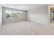 Bonus room with neutral walls, carpet, and natural light from large window at 4528 Venus Sw Ct, Powder Springs, GA 30127