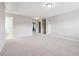 Large bonus room with neutral walls and carpet and multiple entry doorways at 4528 Venus Sw Ct, Powder Springs, GA 30127