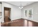 Dining area with hardwood floors and glass doors to the backyard at 4528 Venus Sw Ct, Powder Springs, GA 30127