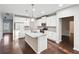 Bright kitchen with a center island, granite counters, and stainless steel appliances at 4528 Venus Sw Ct, Powder Springs, GA 30127