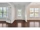 Welcoming foyer featuring hardwood floors and clear views to living spaces with abundant natural light at 4528 Venus Sw Ct, Powder Springs, GA 30127
