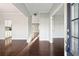 Open-concept living space with hardwood floors, neutral walls, and bright natural light at 4528 Venus Sw Ct, Powder Springs, GA 30127