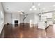Spacious living room with a fireplace and open access to the kitchen and staircase at 4528 Venus Sw Ct, Powder Springs, GA 30127
