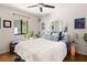 Bright bedroom featuring a ceiling fan, hardwood floors, and a comfy bed at 1355 Euclid Ne Ave # 15A, Atlanta, GA 30307