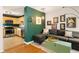 Open-concept living room adjacent to the kitchen, with comfortable seating, hardwood floors, and stylish decor at 1355 Euclid Ne Ave # 15A, Atlanta, GA 30307