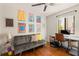 Bright home office featuring a futon, modern desk, and colorful artwork at 1355 Euclid Ne Ave # 15A, Atlanta, GA 30307